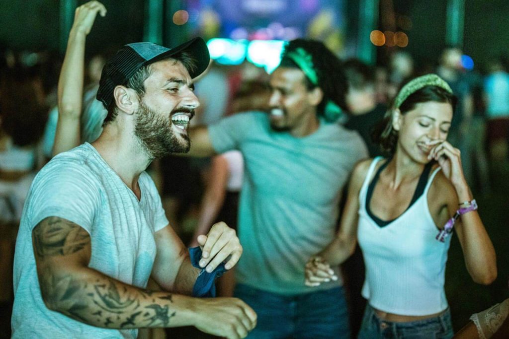 friends dancing at a gig