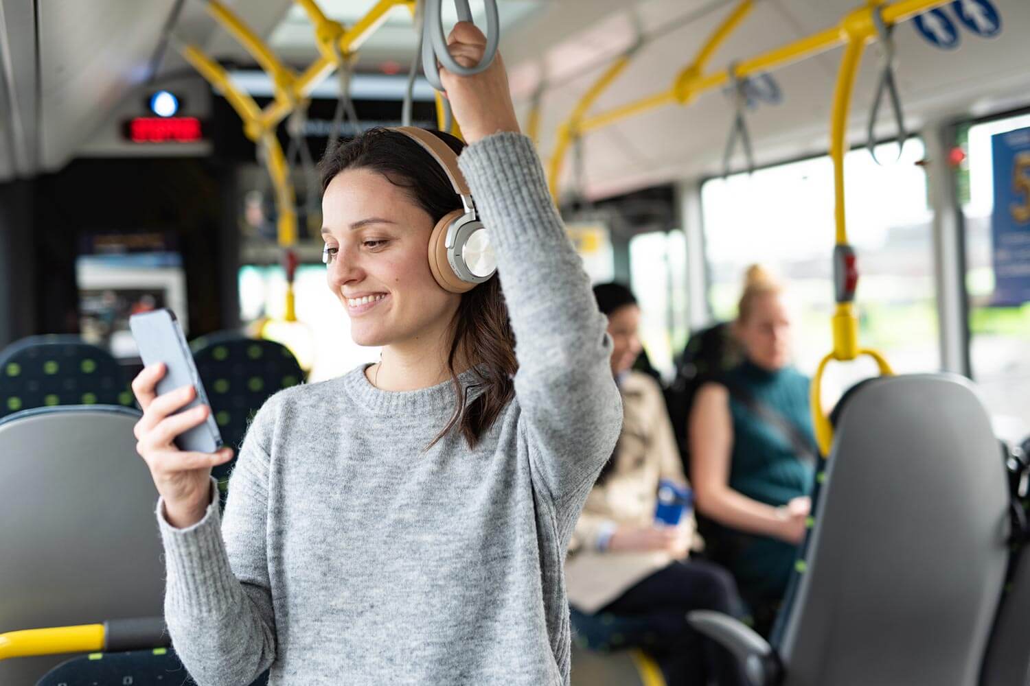 girl on her phone on public transport