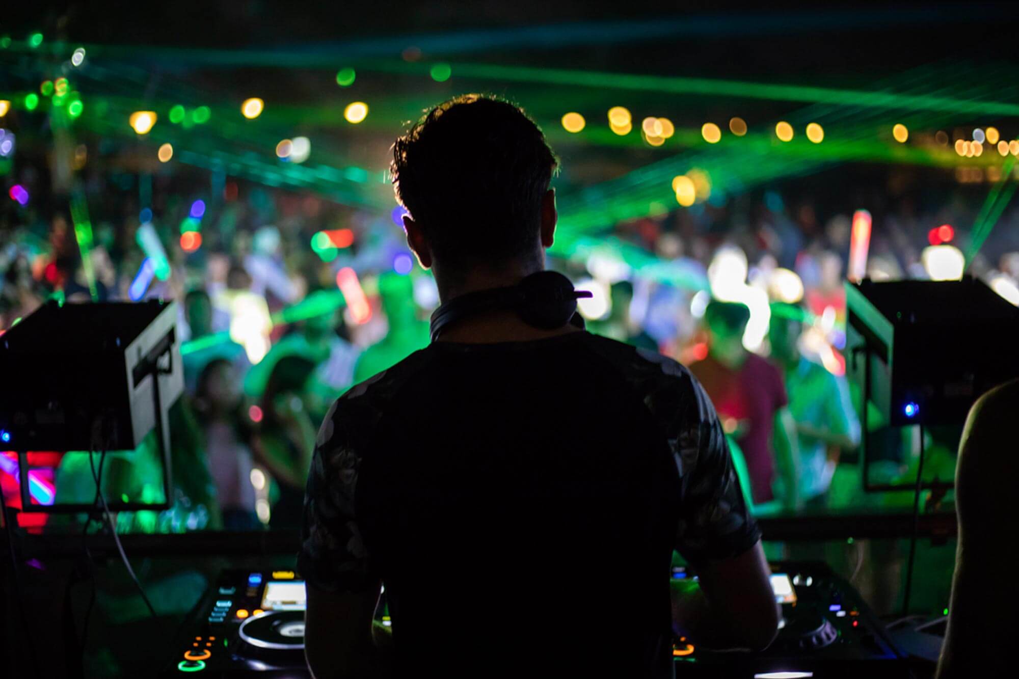 silhouette of dj behind the decks
