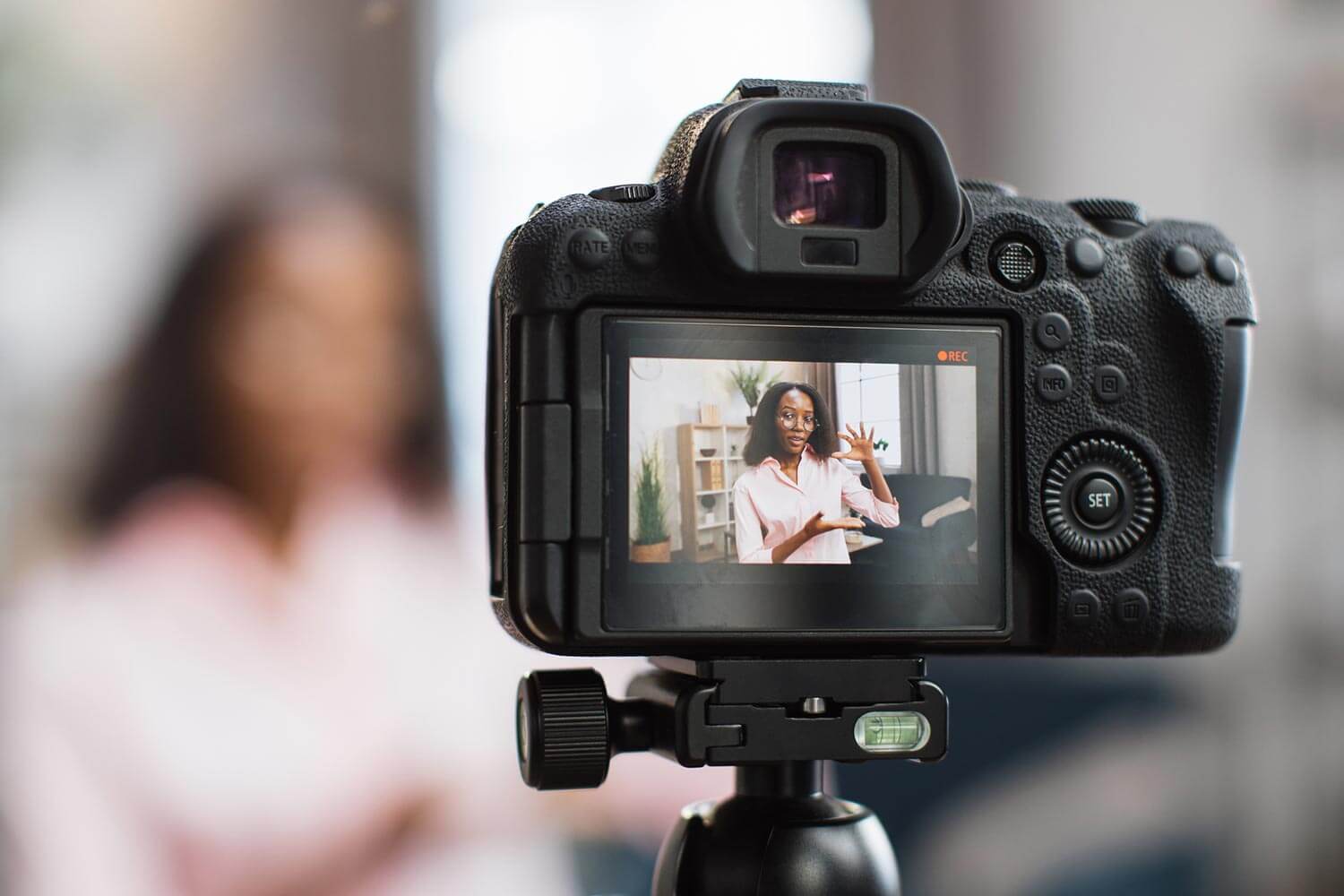woman being filmed on slr
