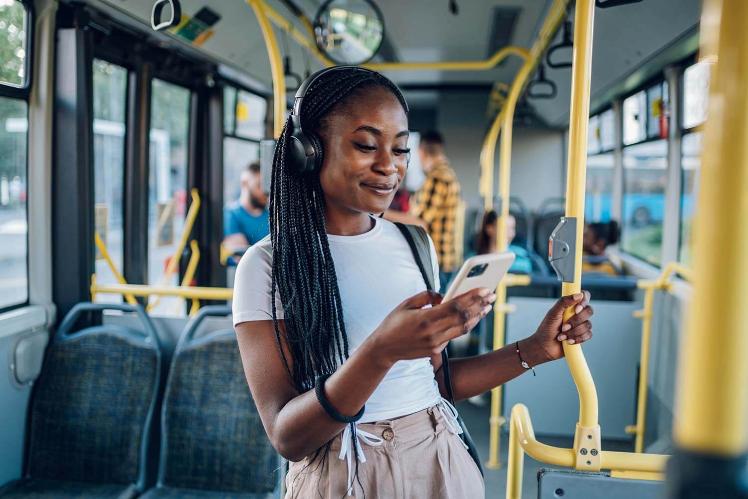 young woman on public transport looking at her phone