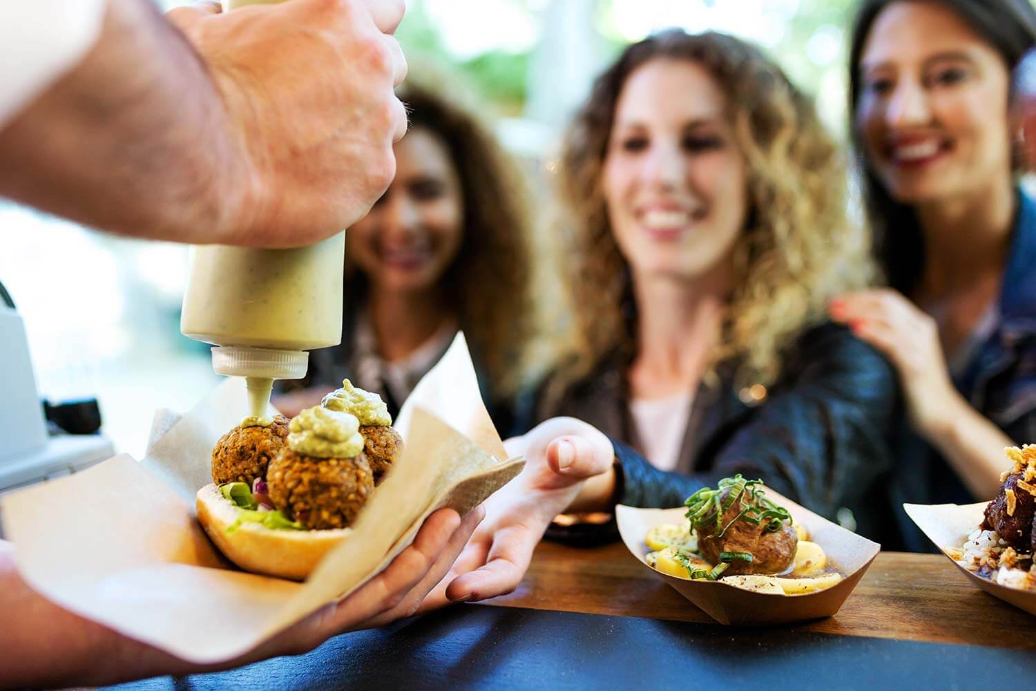 People being served food at a food stall