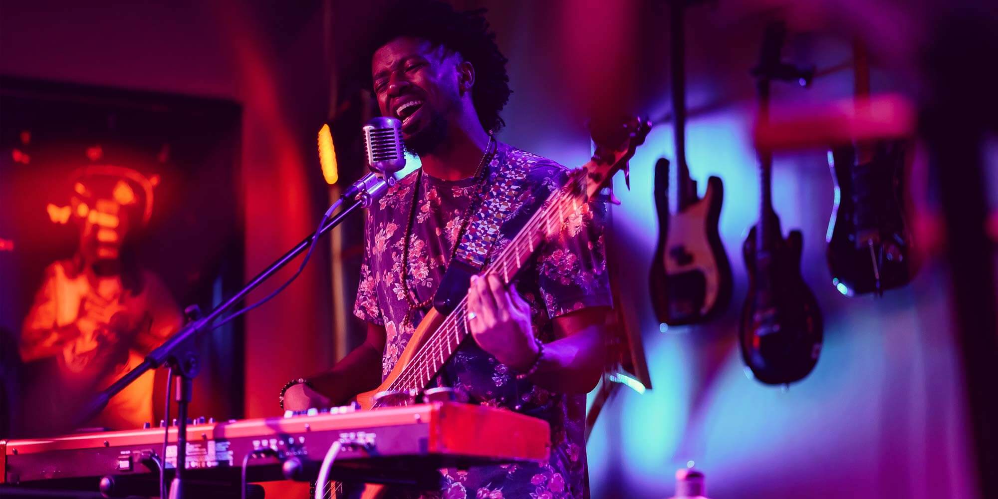 Musician on stage playing a guitar